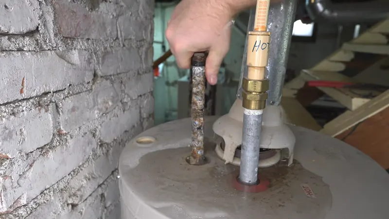 Corroded anode rod removed from a tank water heater during a repair visit